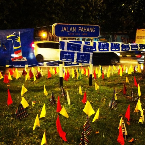 Malaysian police are frightened of flowers - flags placed by citizens for a Malaysian Spring